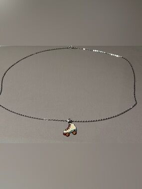 Silver roller skate necklace